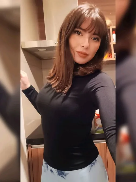 Woman with a fringe in a black top